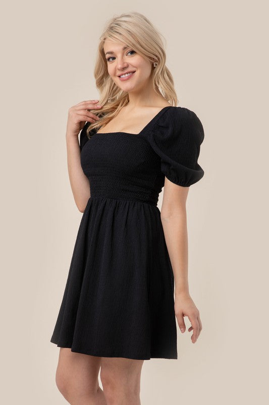 Load image into Gallery viewer, Lilou Puff sleeved smocked dress
